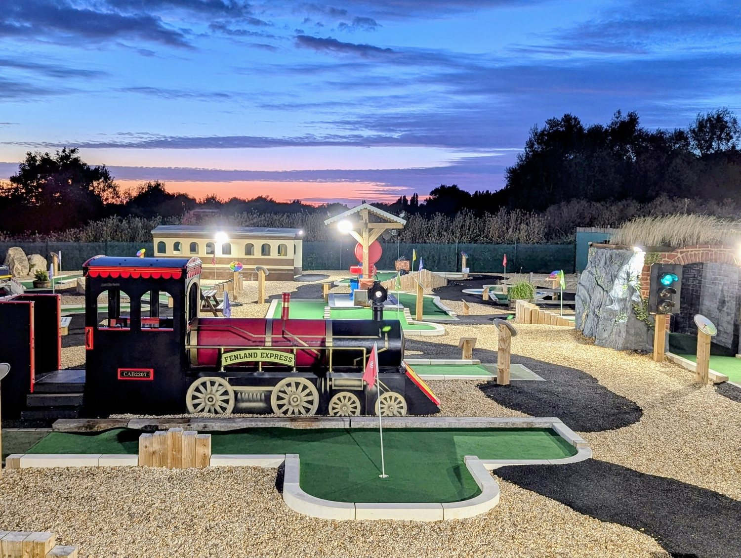 The Fenland Express locomotive hole floodlit at dusk at Play2Day Wisbech